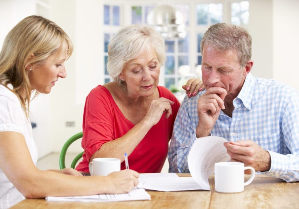 Retired couple with financial advisor Retired couple with financial advisor